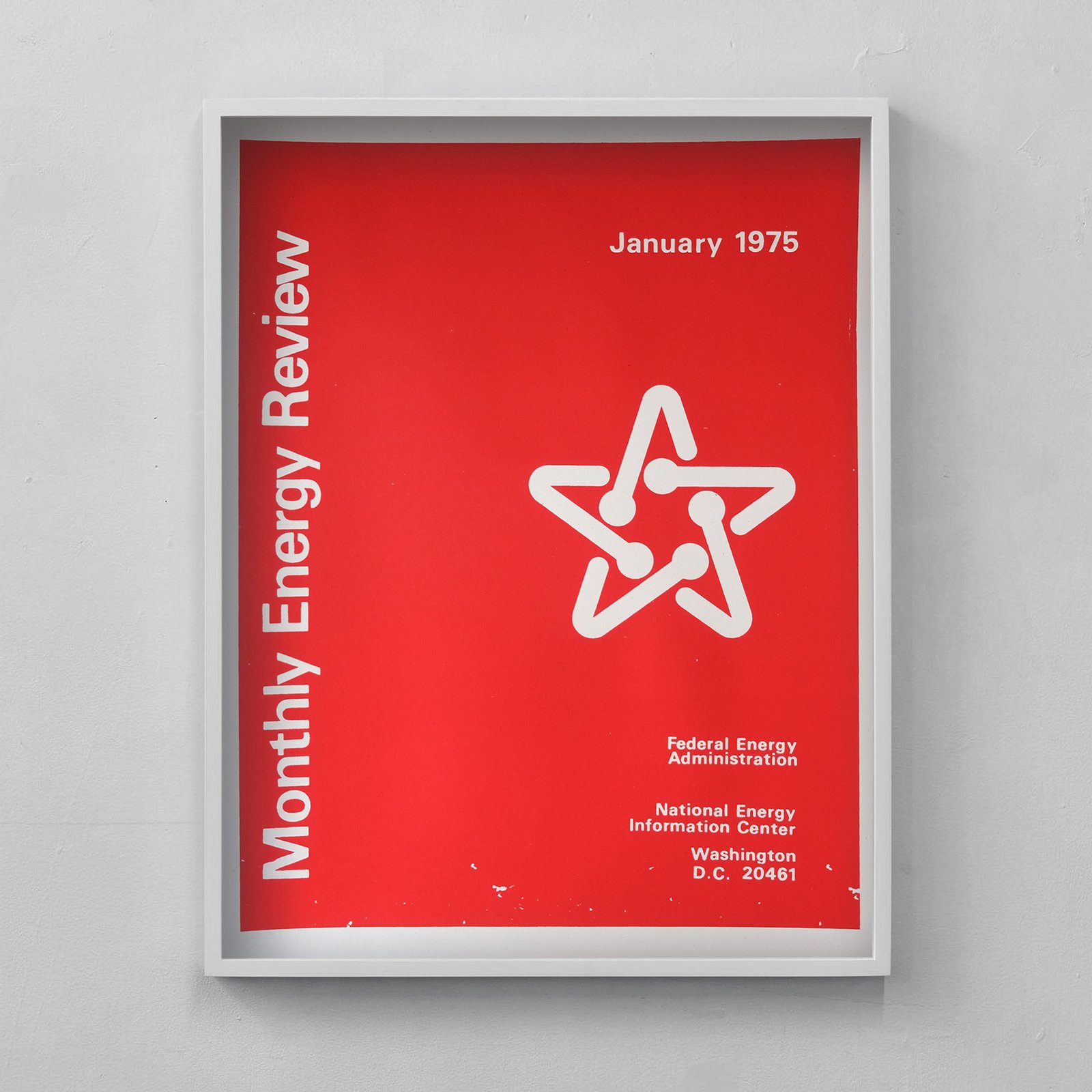 a red ink on cream paper poster of the Monthly Energy Review cover from January 1975